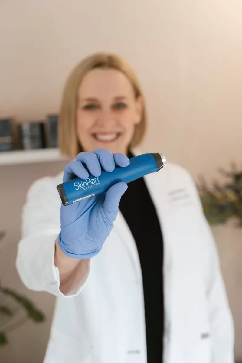 Tammy Kirby holding SkinPen Microneedling device