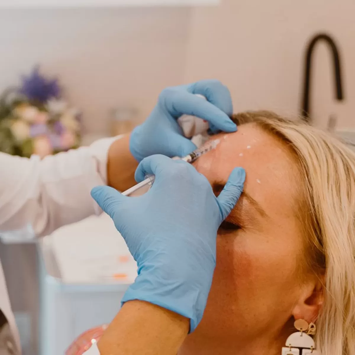 female getting Botox for forehead