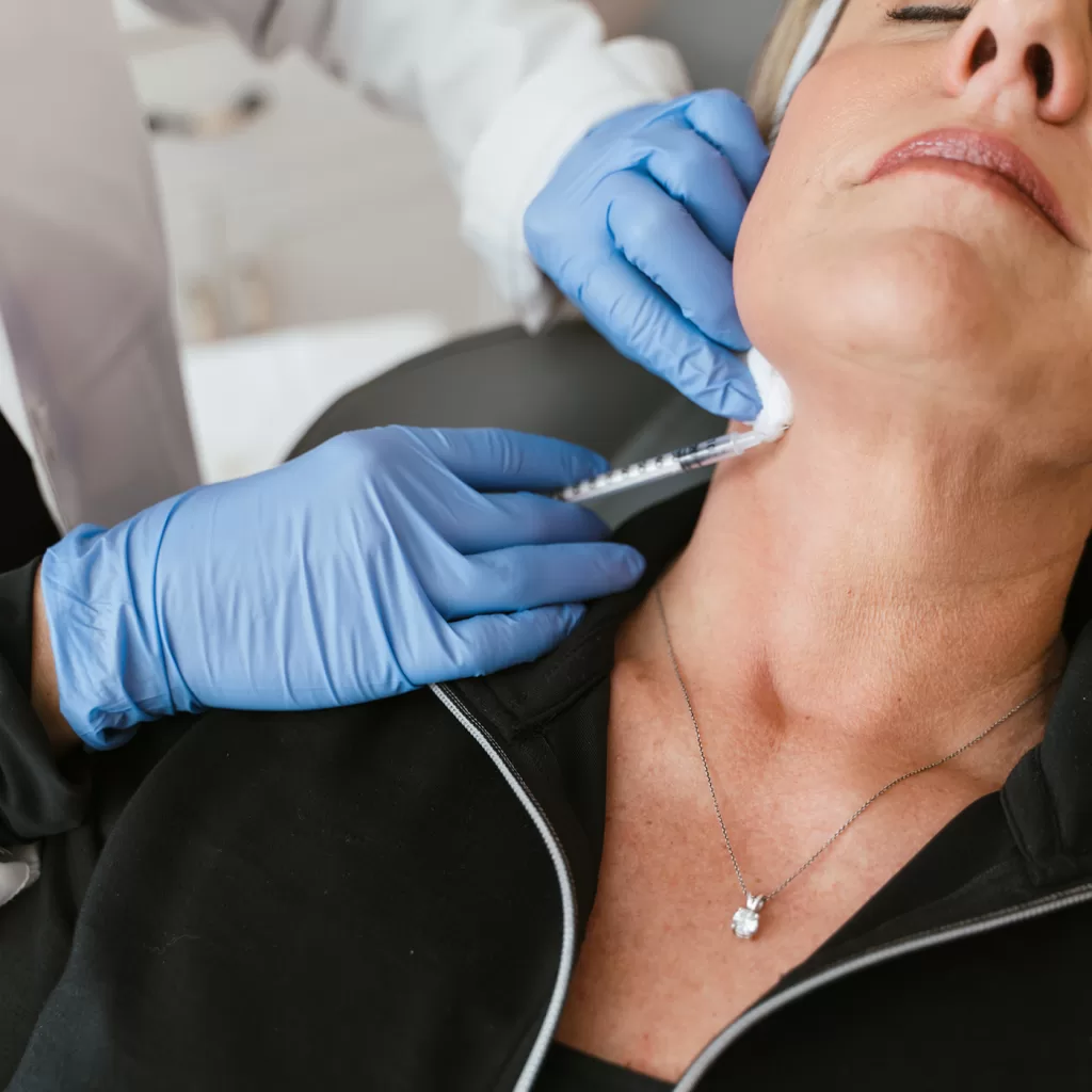 female patient receiving Botox injection for neck
