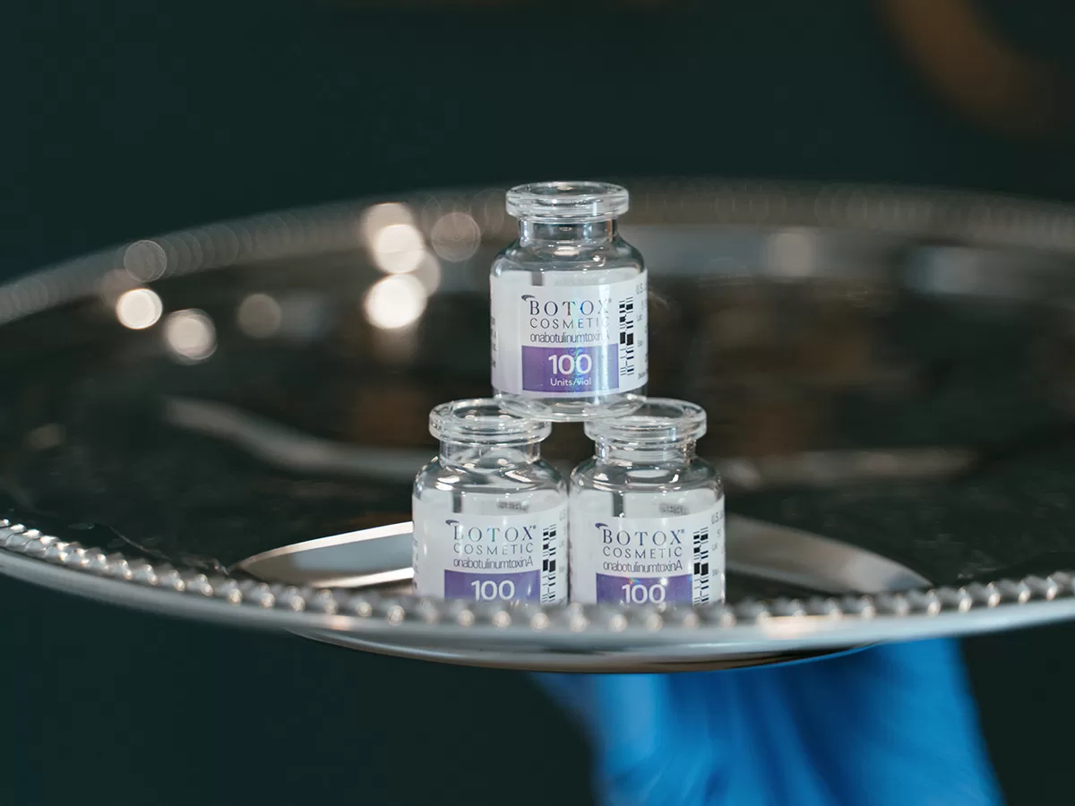 vials of botox on a silver platter
