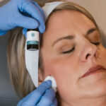 provider applying chemical peel solution on a patients face